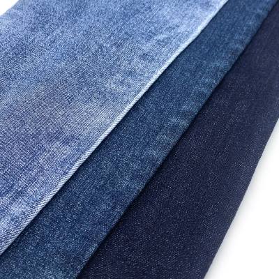 GX-AF B6024 Width: 178-180cm Weight: 9.6OZ Shrinkage: Warp:6-7% Weft:13-15% Weave: Right-hand twill Composition: 64.0% Cotton, 31.5% Tencel , 3.6% Rayon, 0.9% Spandex 10 count Slub yarn Super Sirospun TR dual core Medium stretch detail view-1